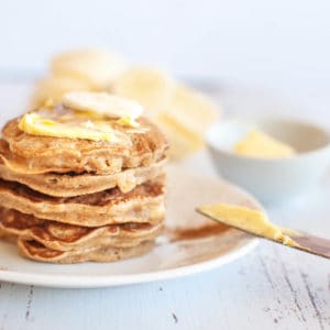 a stack of 5 banana pikelets with butter