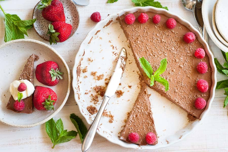 Sliced chilli chocolate cheesecake in a white dish