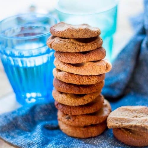 A tall stack of sugar free ginger cookies on a blue towel