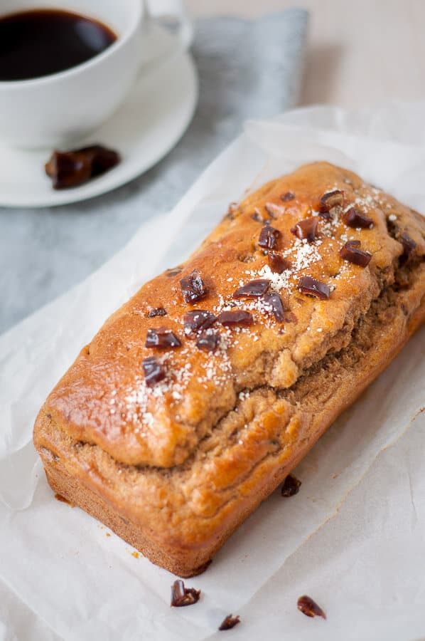 A whole healthy date loaf on baking paper