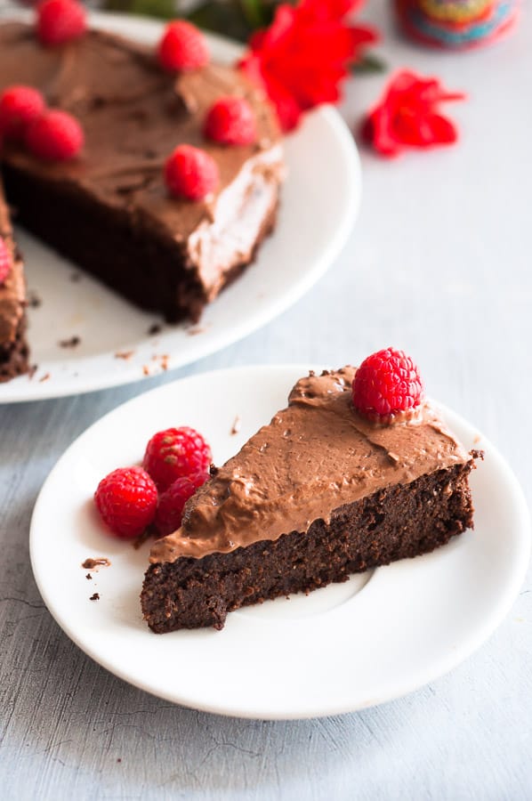 A slice of gluten free mud cake on a plate