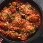 oven pan with chicken caccitore and black olives