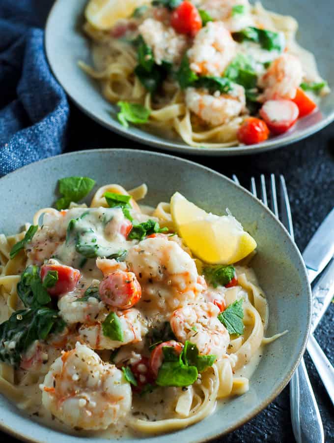 Creamy garlic prawn fettucine in a blue bowl