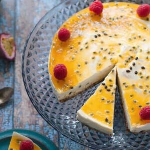 sugar free passionfruit cheesecake sliced on a serving platter
