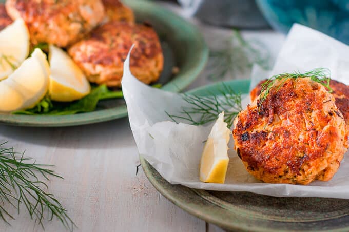 close up of salmon fritters with lemon