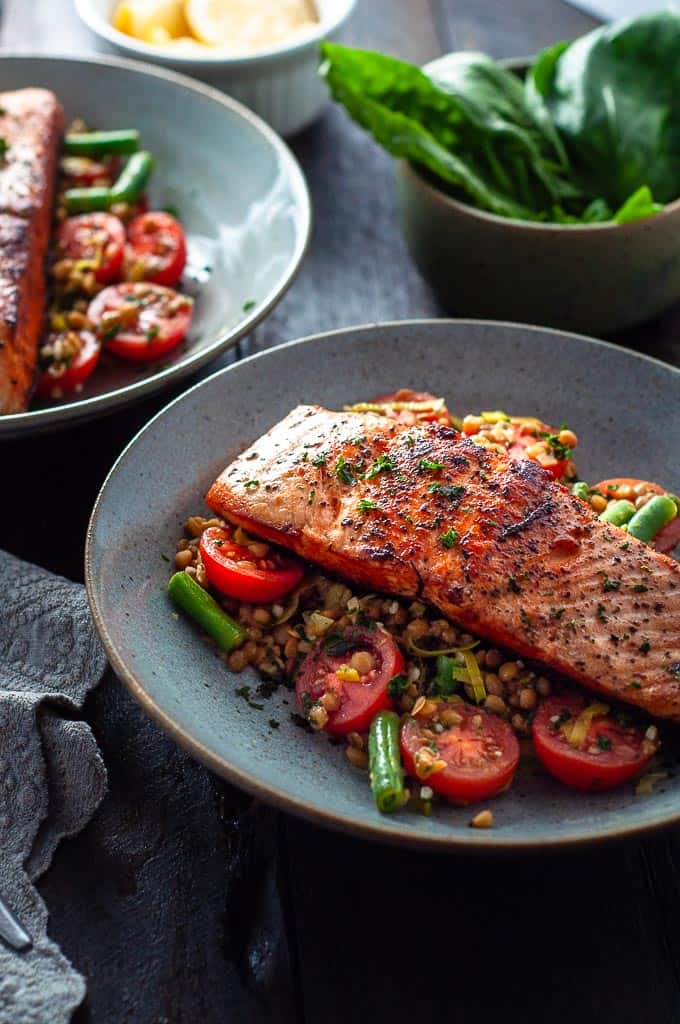 Salmon with leeks and lentils on a plate