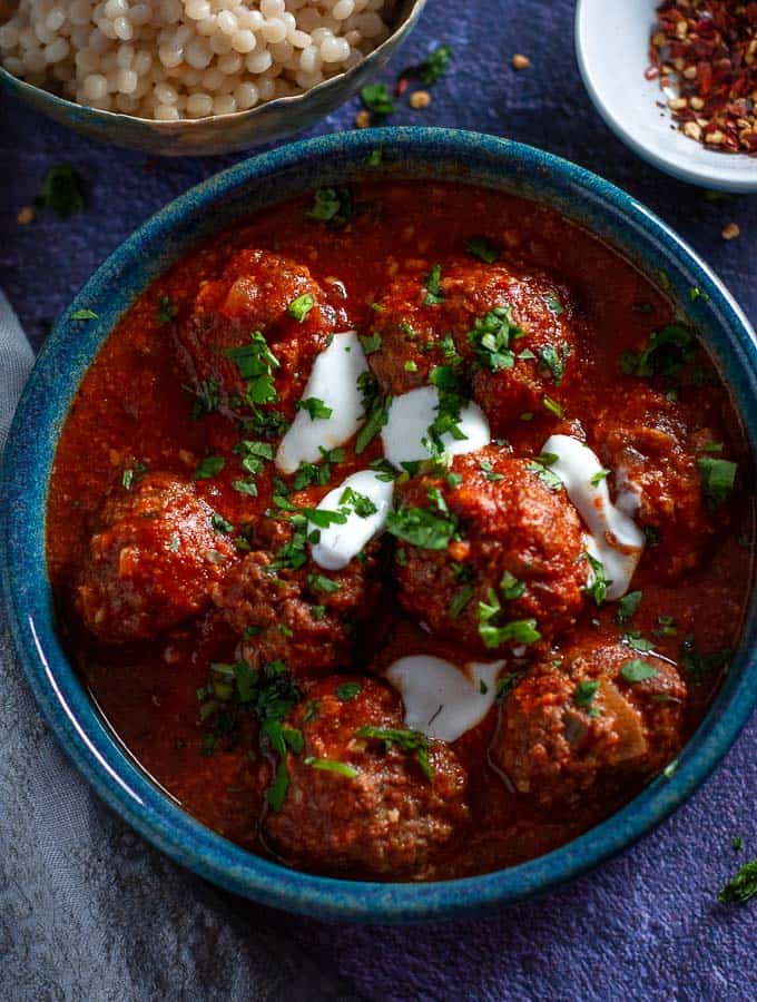 A bowl of slow cooker moroccan meatballs in rich tomato sauce