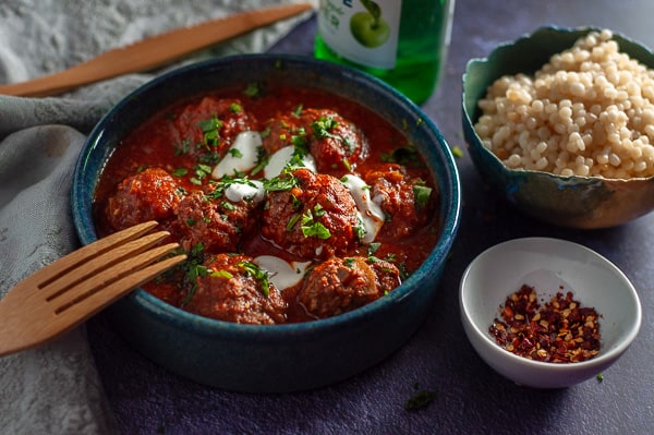 Slow Cooker Moroccan Meatballs with fork in