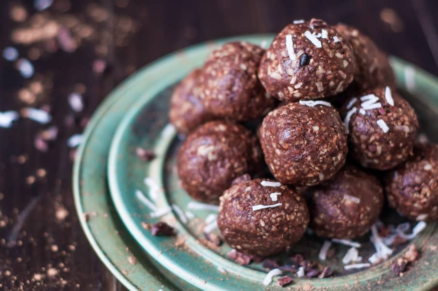 Cacao Bliss balls stacked on a plate