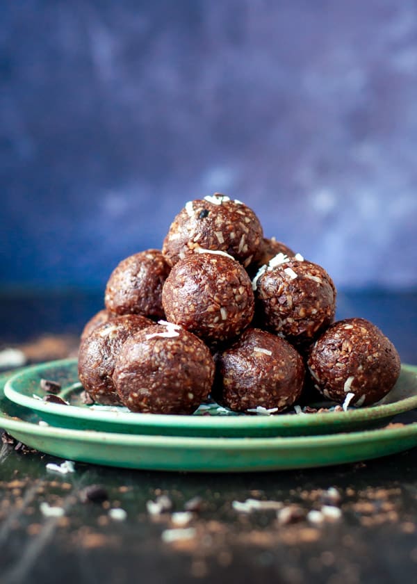 A plate of stacked chocolate Cacao Bliss Balls