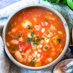 a bowl of vegetable and barley soup