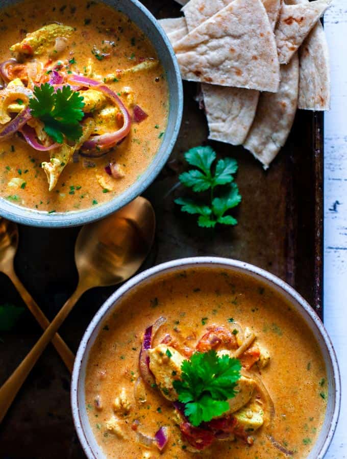Two bowls of Indian coconut chicken curry