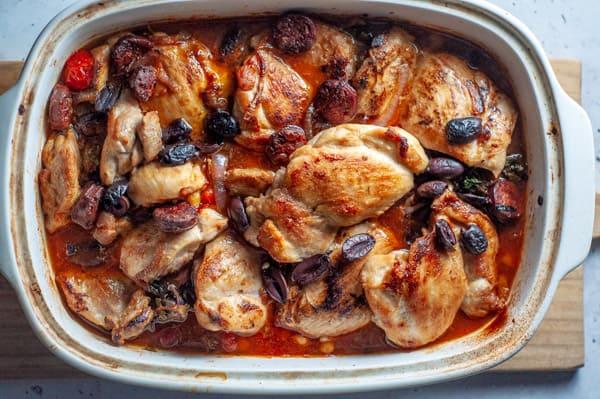 Spanish chicken tray bake in a casserole dish out of the oven