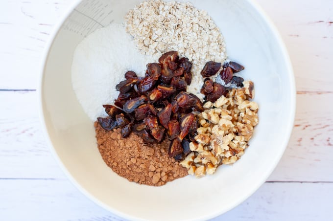 Chocolate date slice ingredients in a bowl