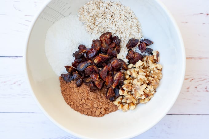 Chocolate date slice ingredients in a bowl