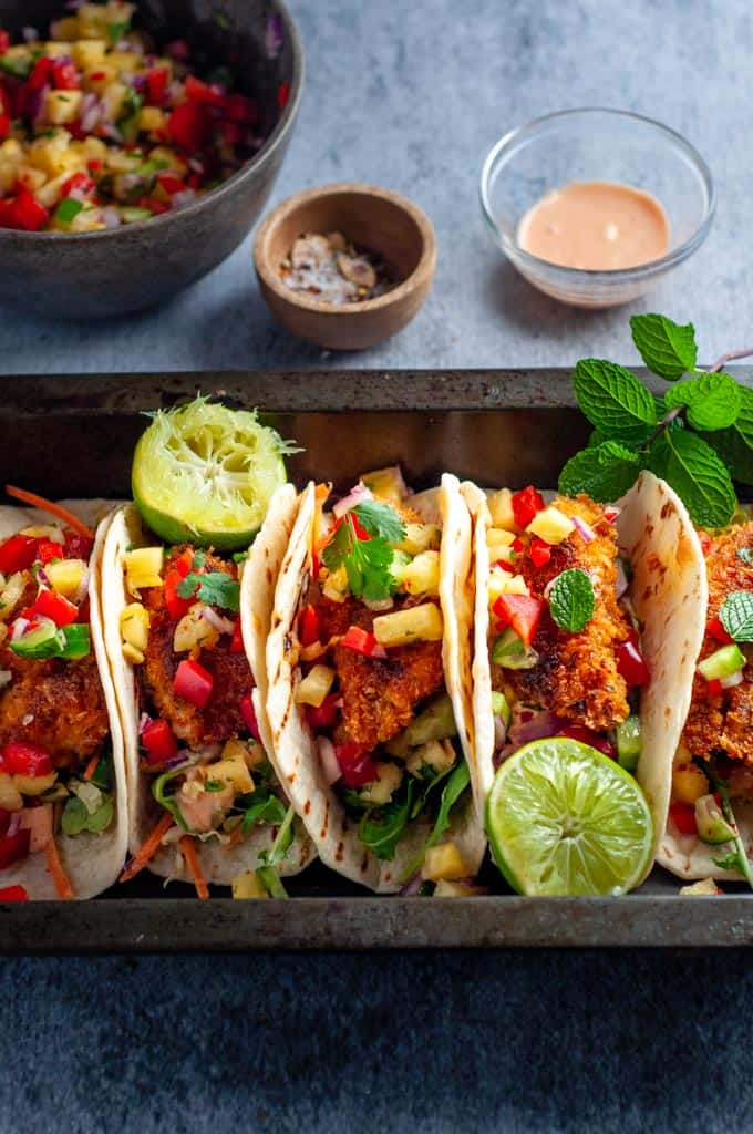 fish tacos with pinapple salsa and lime