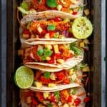 Fish tacos with pineapple salsa in a tray