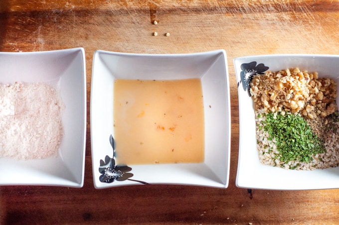 Three bowls of chicken crumbing mix