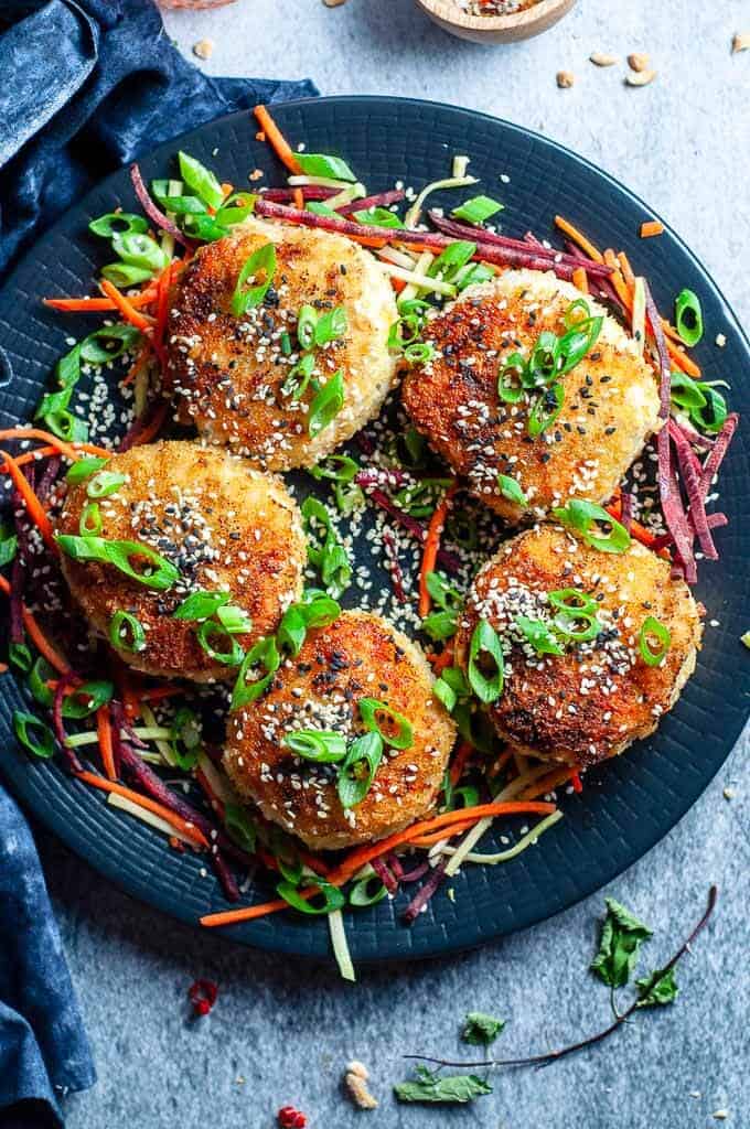 black plate with chicken rissoles on top