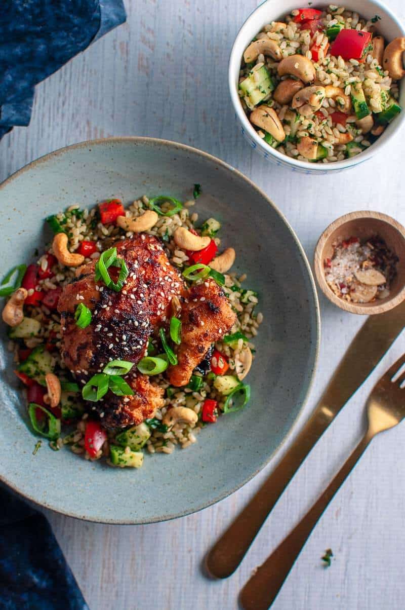 Sticky asian glazed chicken in a blue bowl