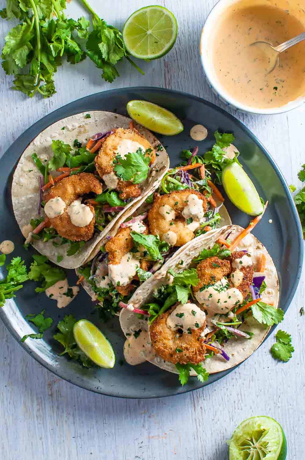 crispy prawn tacos on a plate