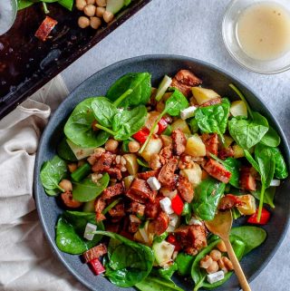 Summer sausage salad in a bowl with fork ready to eat