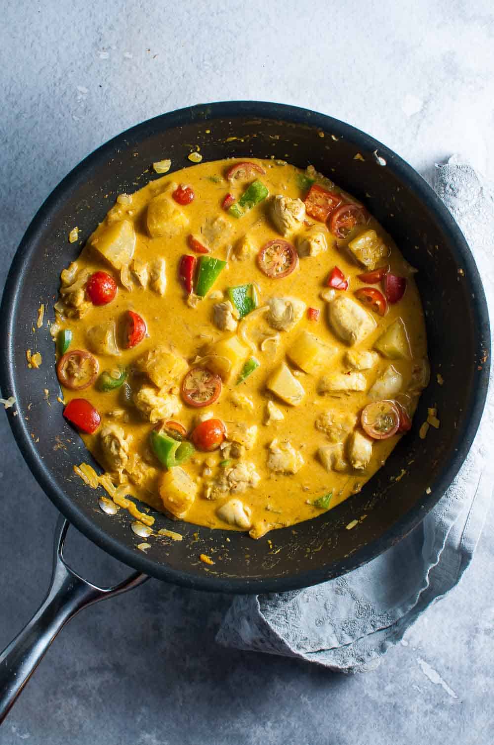 pineapple chicken curry in a pan