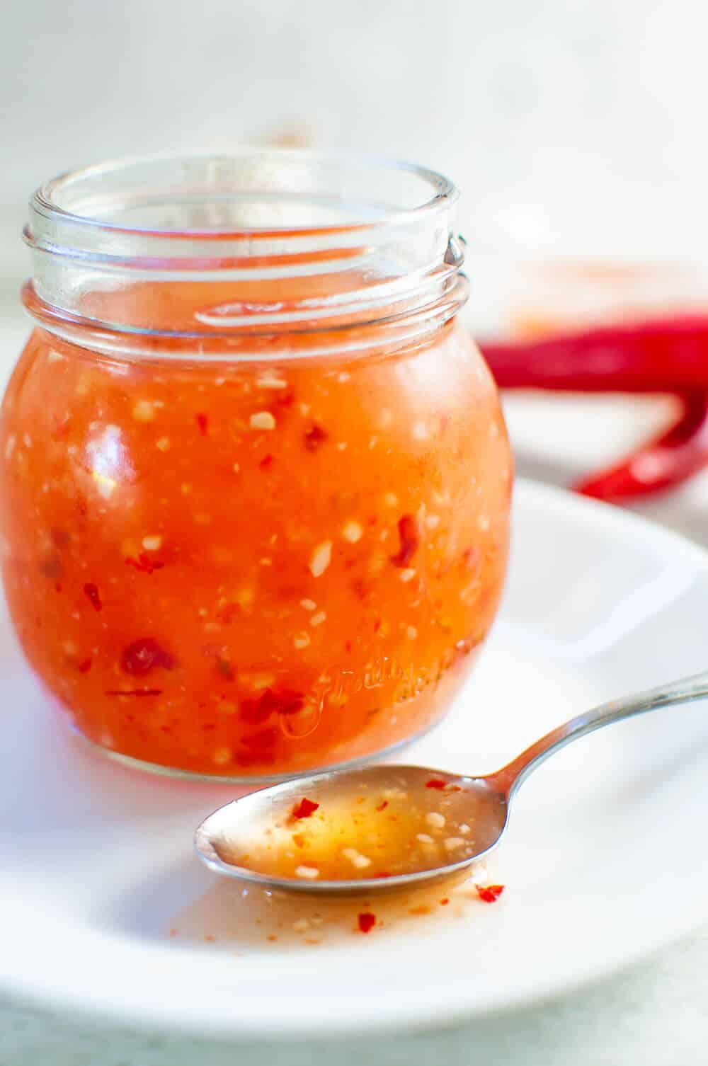 a jar of homemade healthy sweet chilli sauce