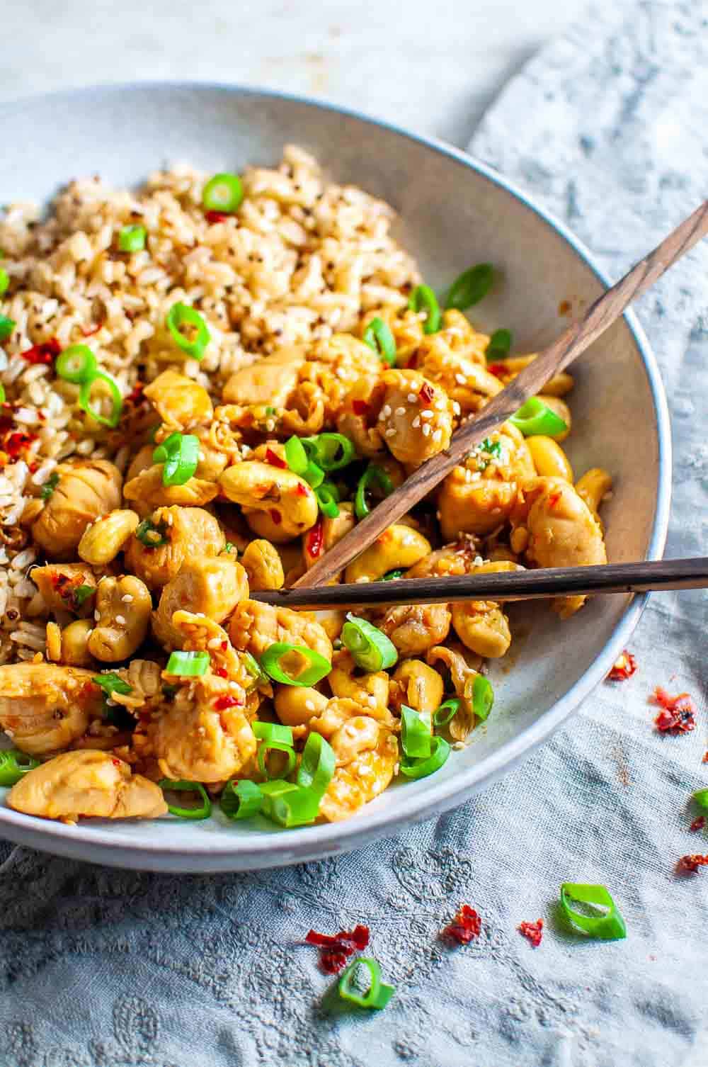 Chopsticks in a bowl of honey chilli chicken