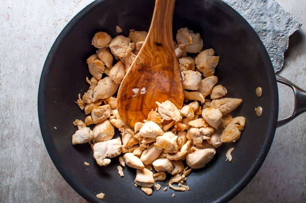 Stirfry chicken in a wok