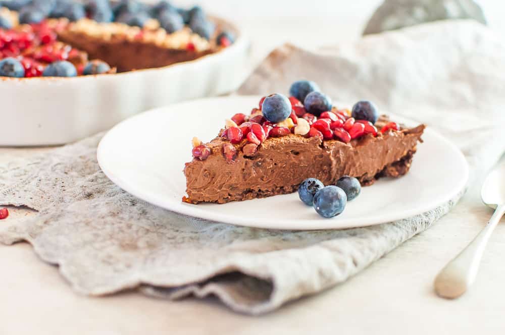 a slice of no bake chocolate tart on a plate