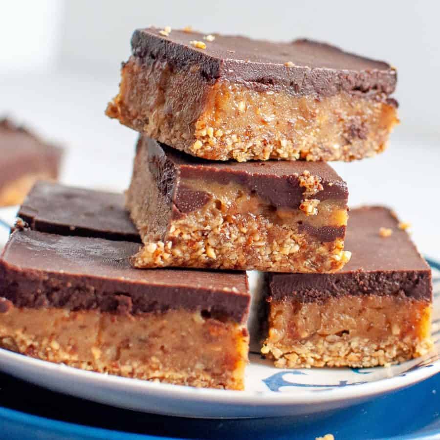 raw caramel slice on a blue plate