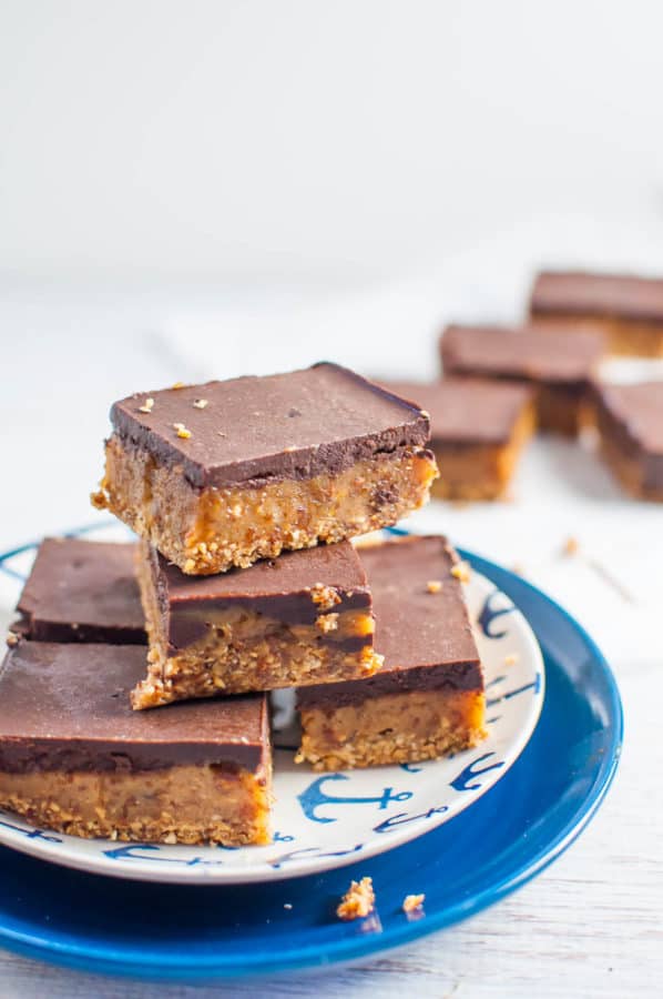 Raw caramel slice stacked on a plate