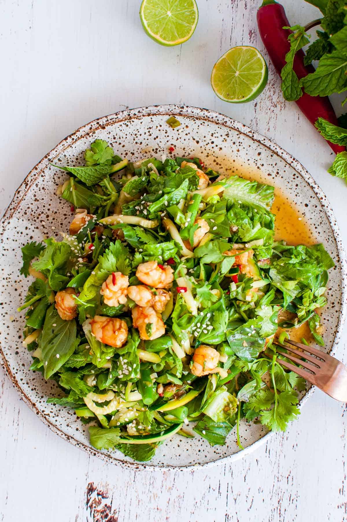 thai prawn salad on a plate with fork