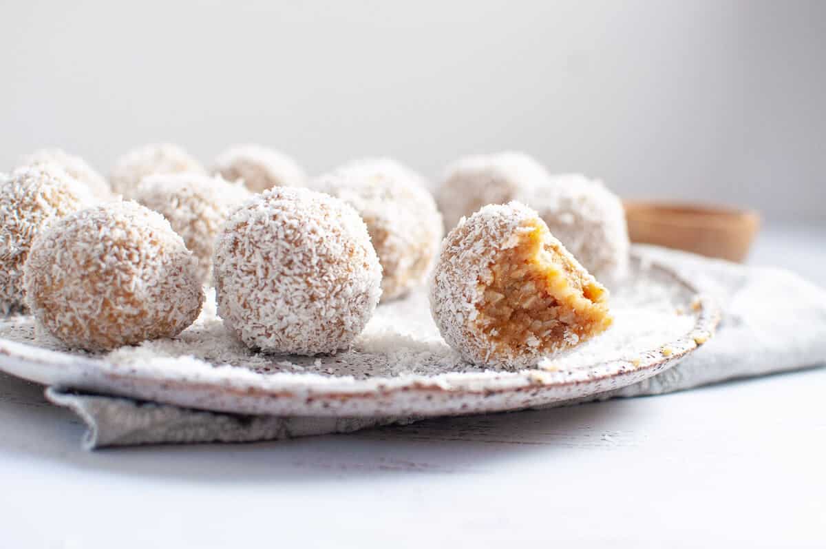 lemon coconut bliss balls on a plate