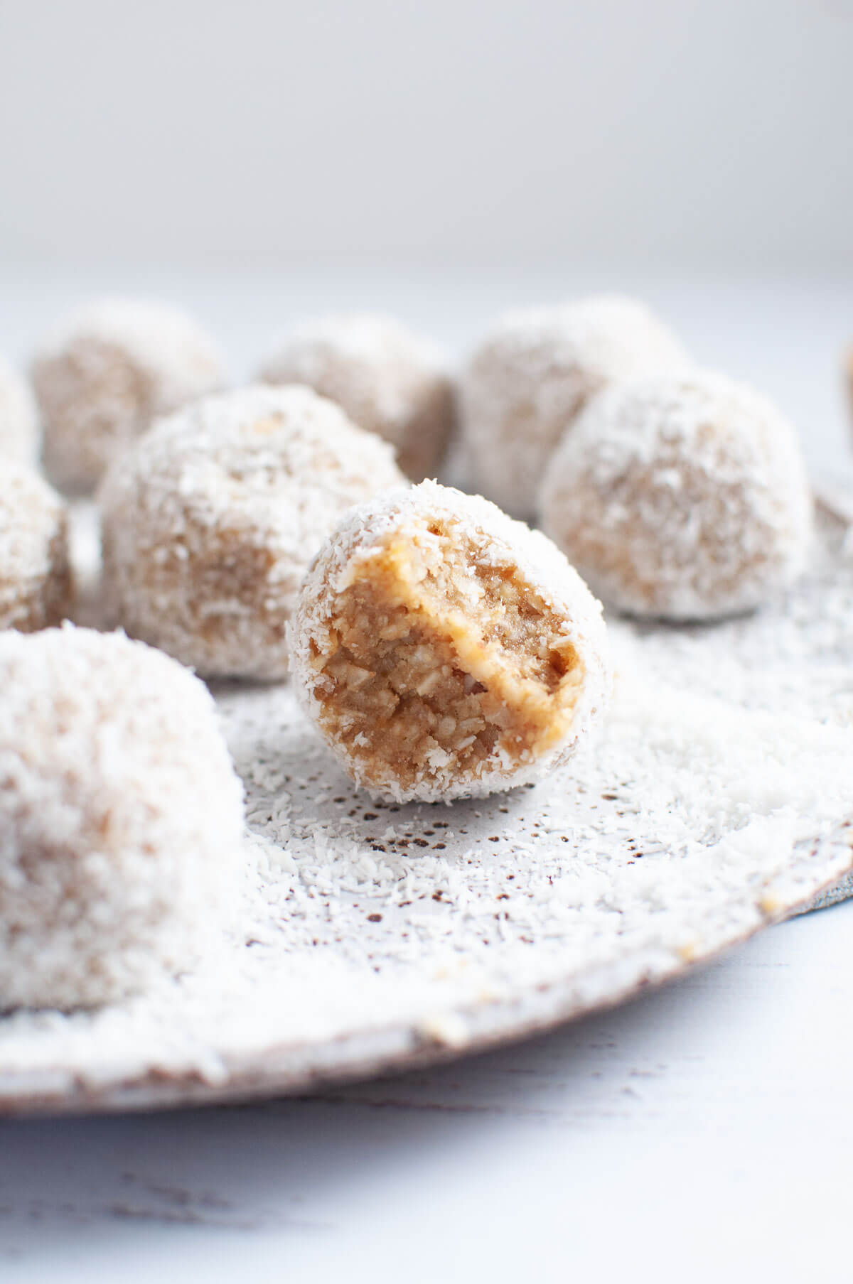 coconut bliss ball with a bite out
