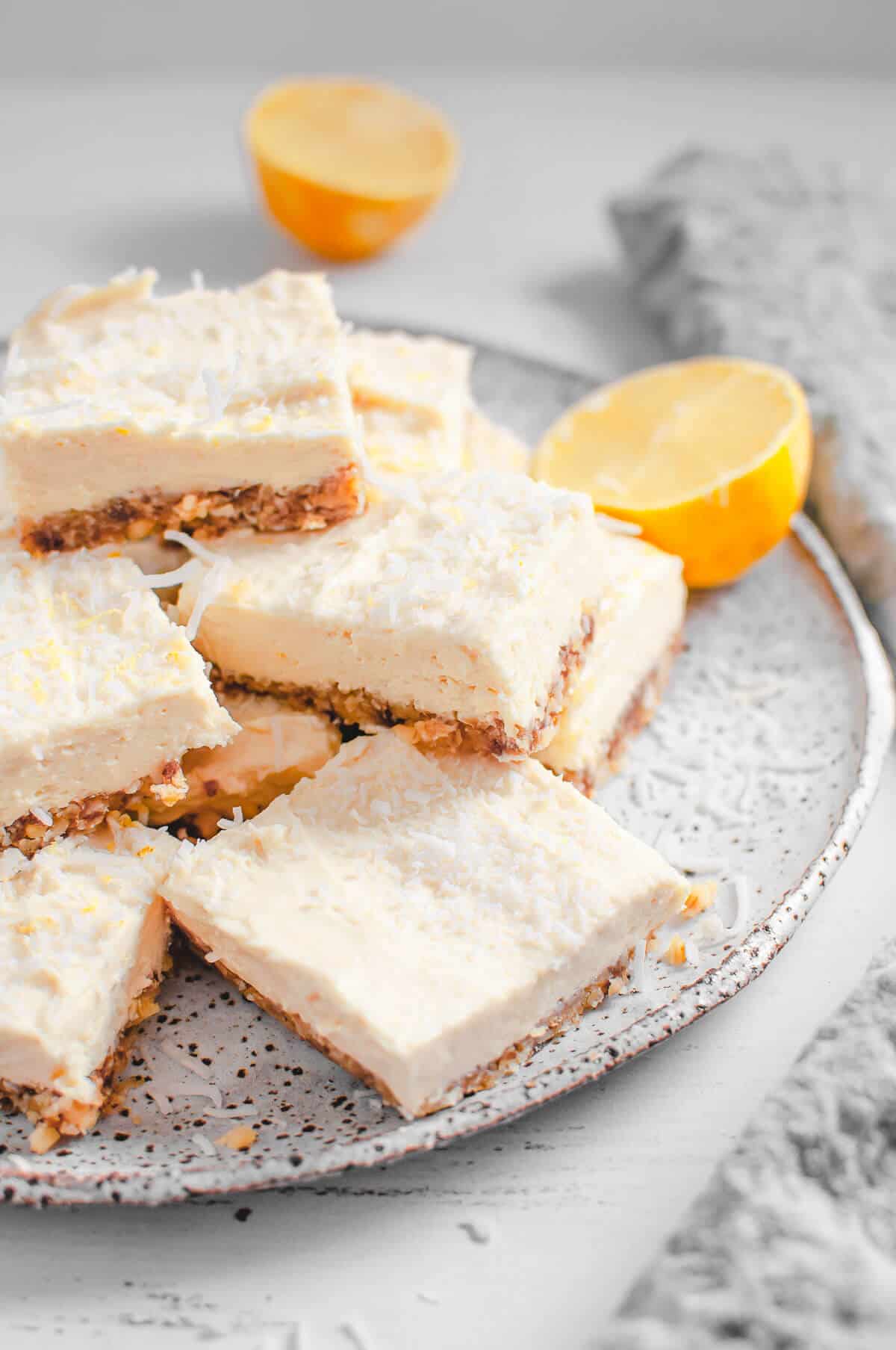 sugar free lemon cheesecake bars on speckled plate