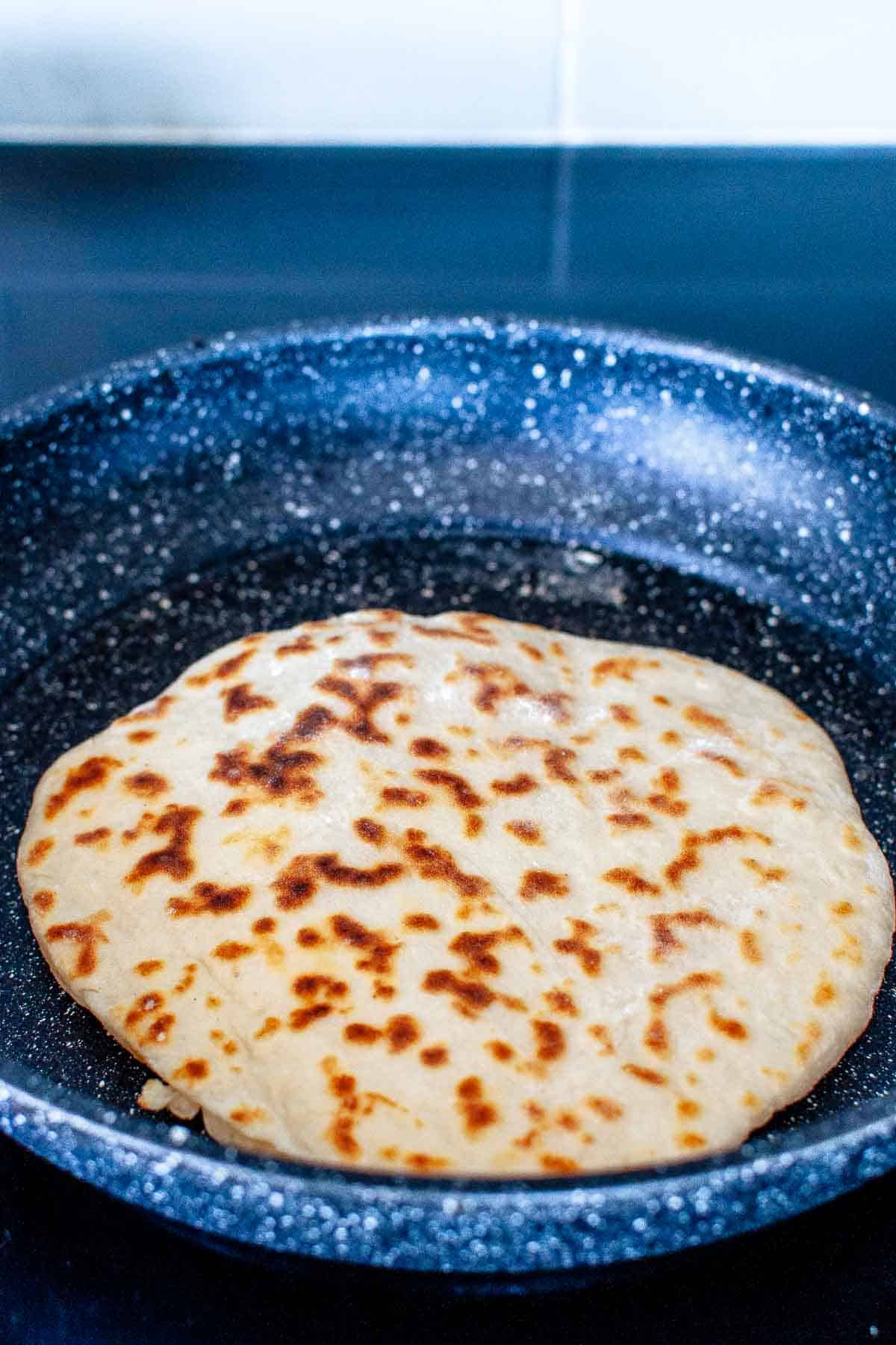 Cooking flatbread in a pan