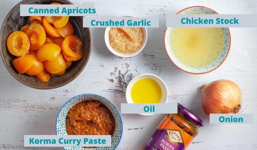 Apricot chicken curry ingredients on a table