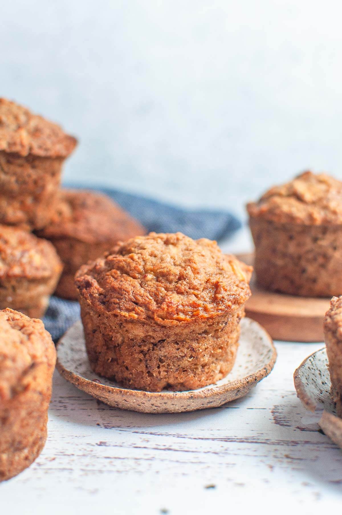 a single apple muffin on a small plate