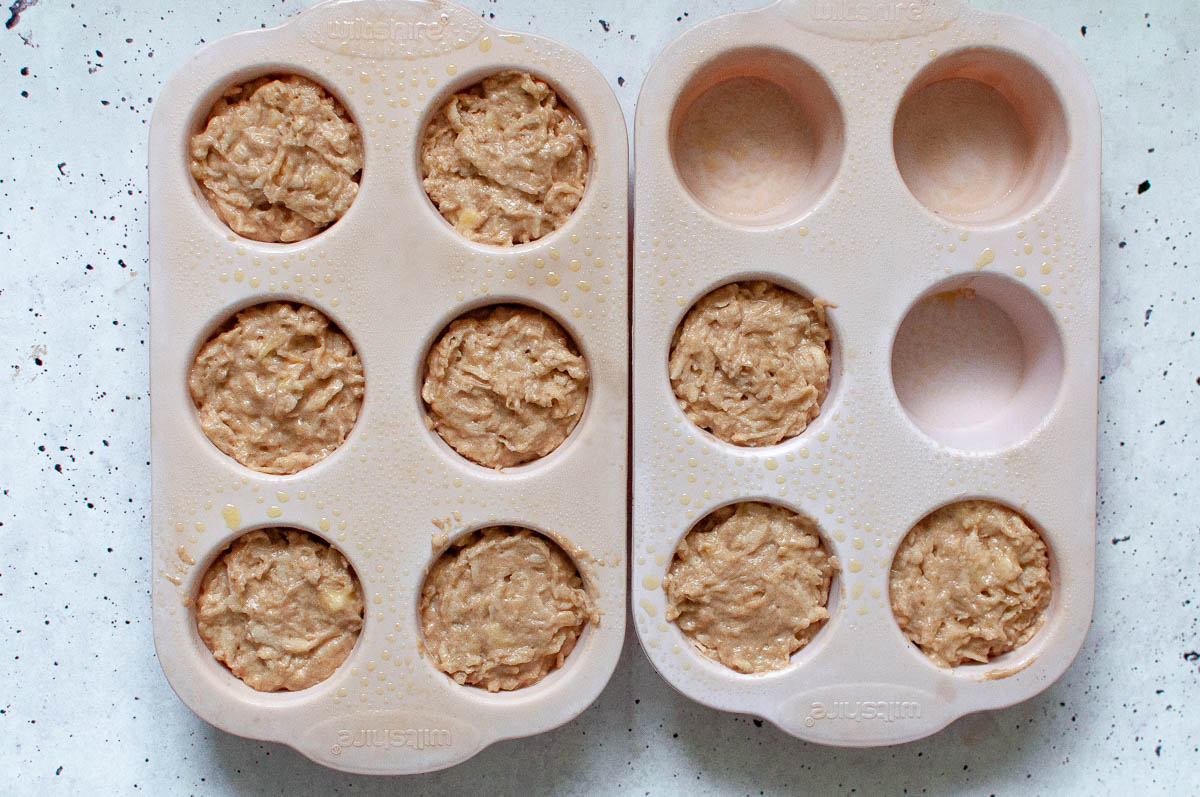 muffin mixture spooned into muffin cases