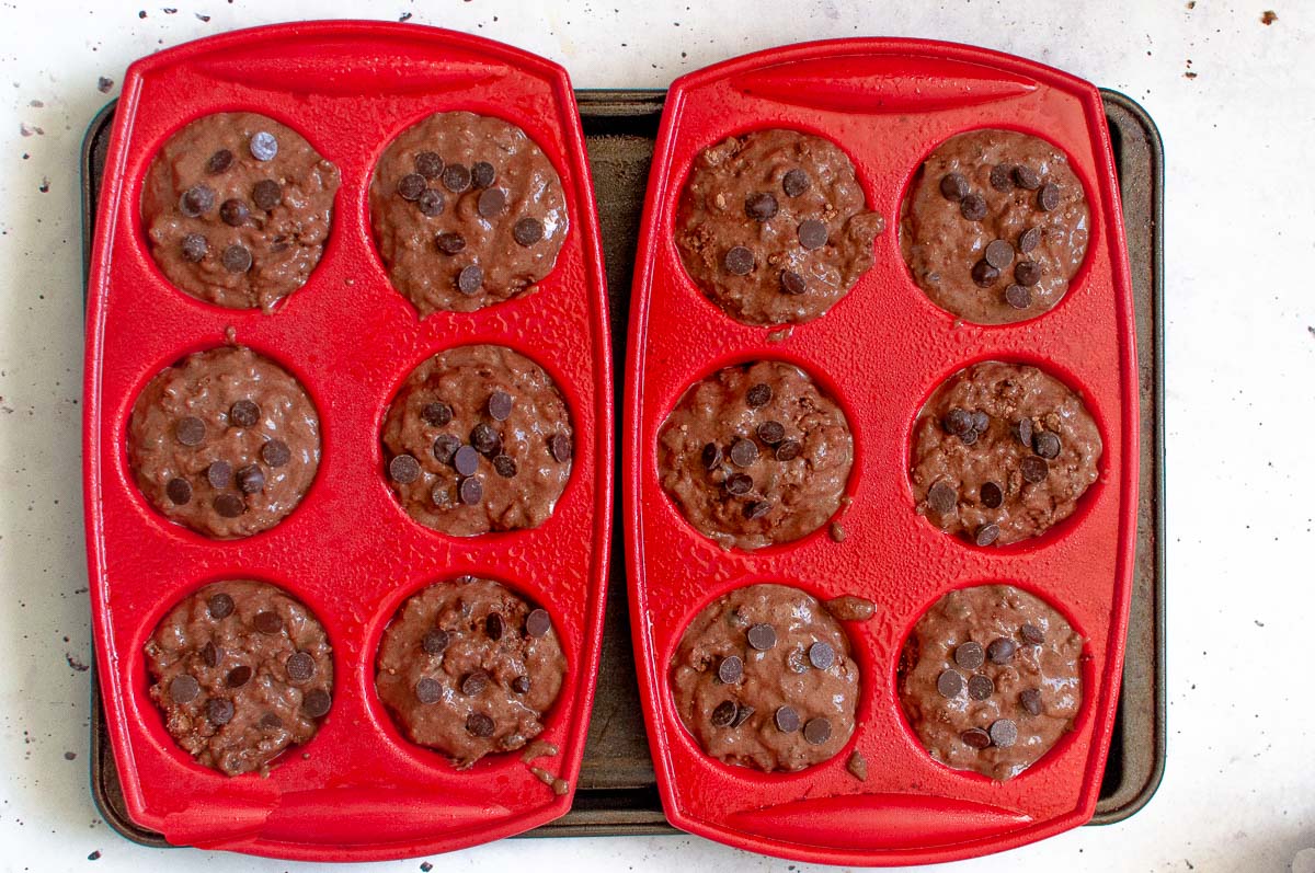 muffin trays with muffin batter poured in