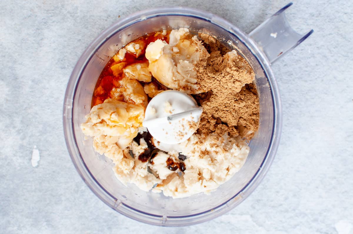 ginger slice top layer ingredients in food processor before blitzing