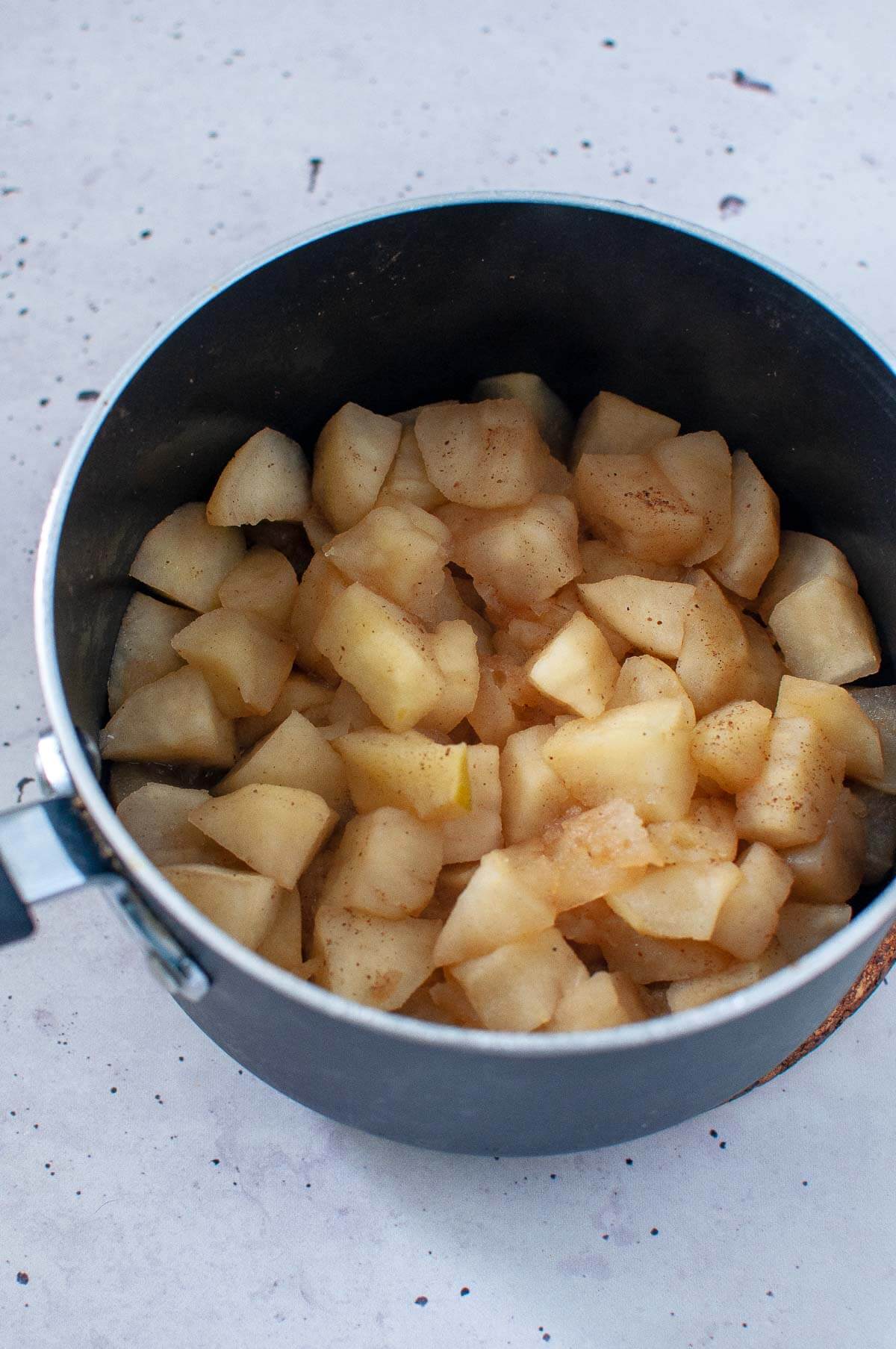 cooked apples in a pot after 12 minutes on stove