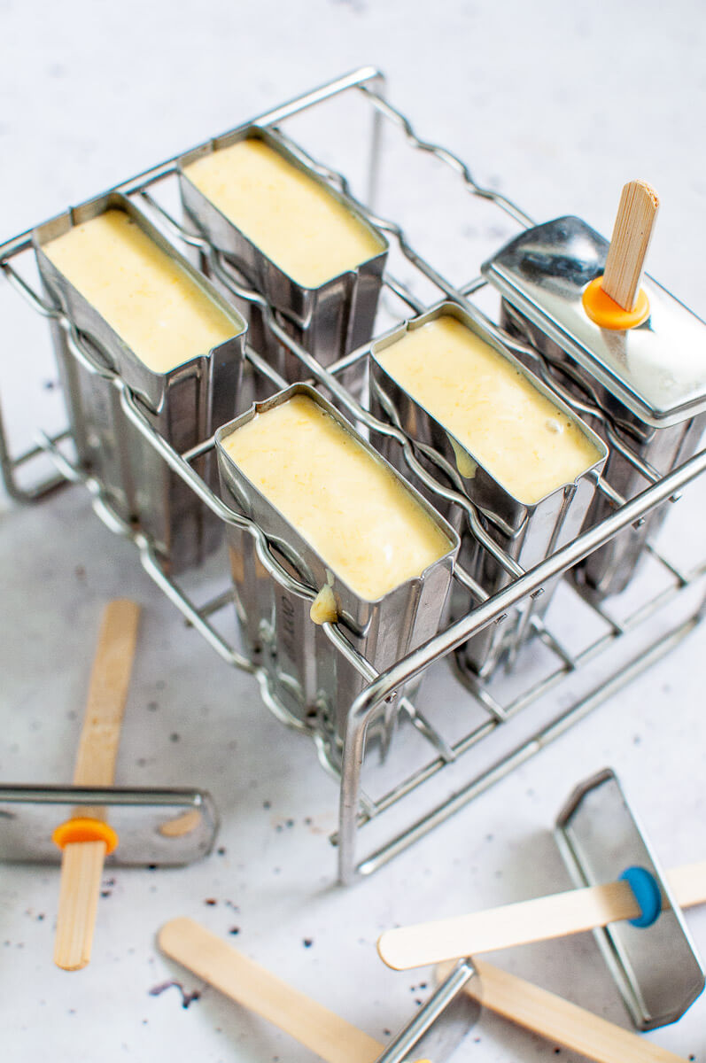 mango popsicles in popsicle molds