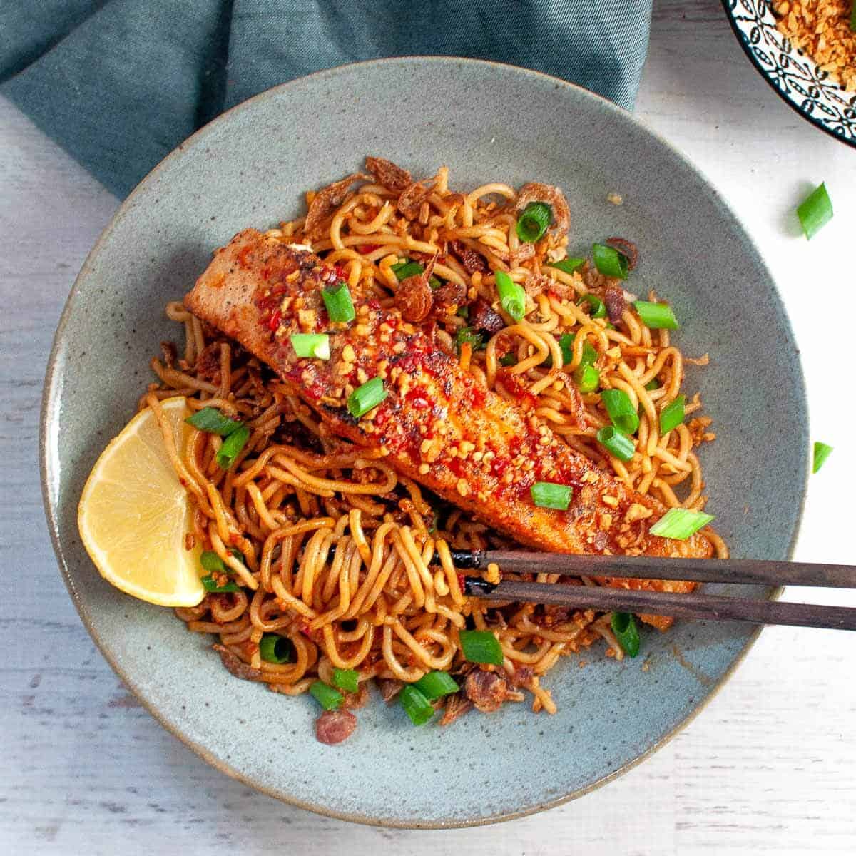 Salmon Noodles in a bowl with chopsticks ready to eat