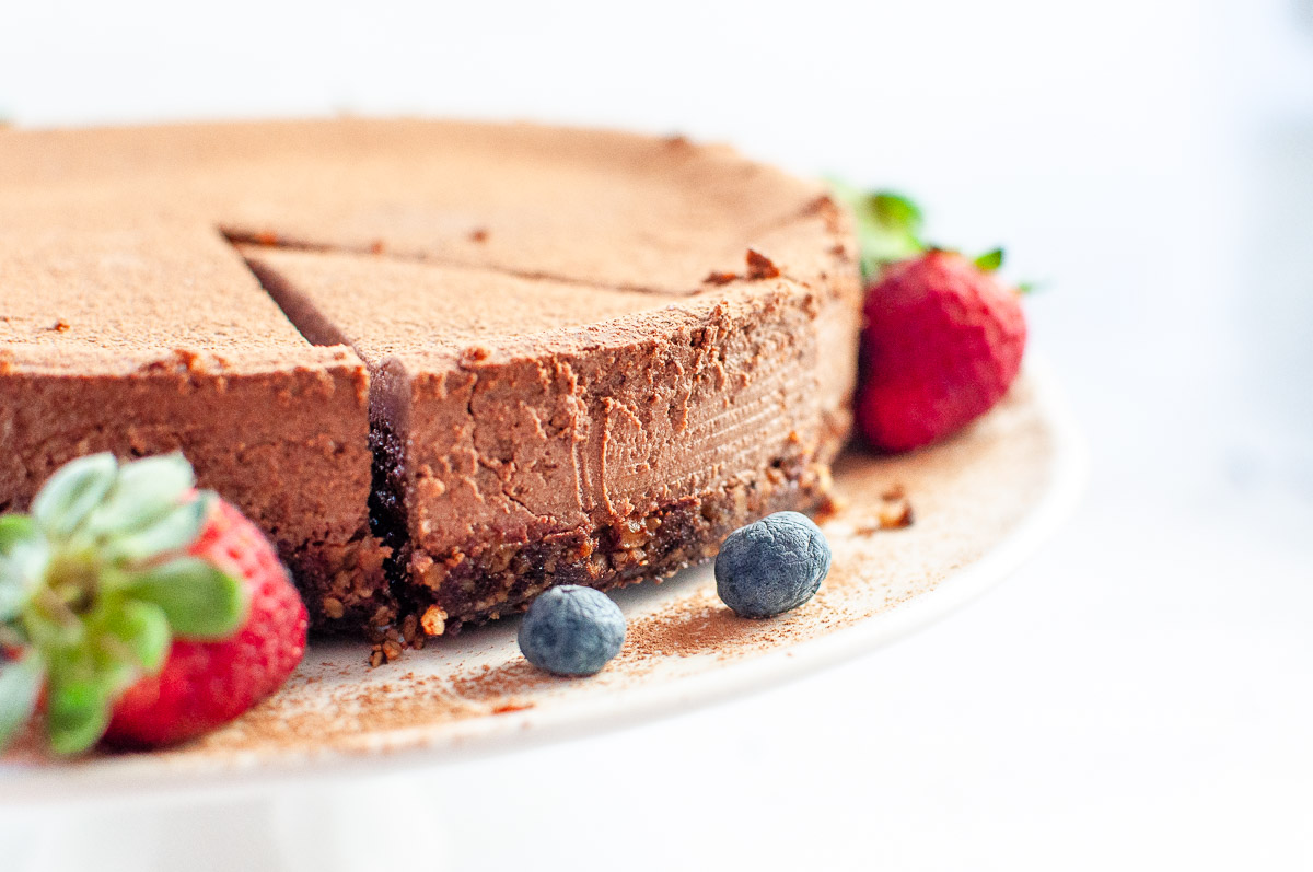 chocolate ricotta cheesecake on a platter ready for serving