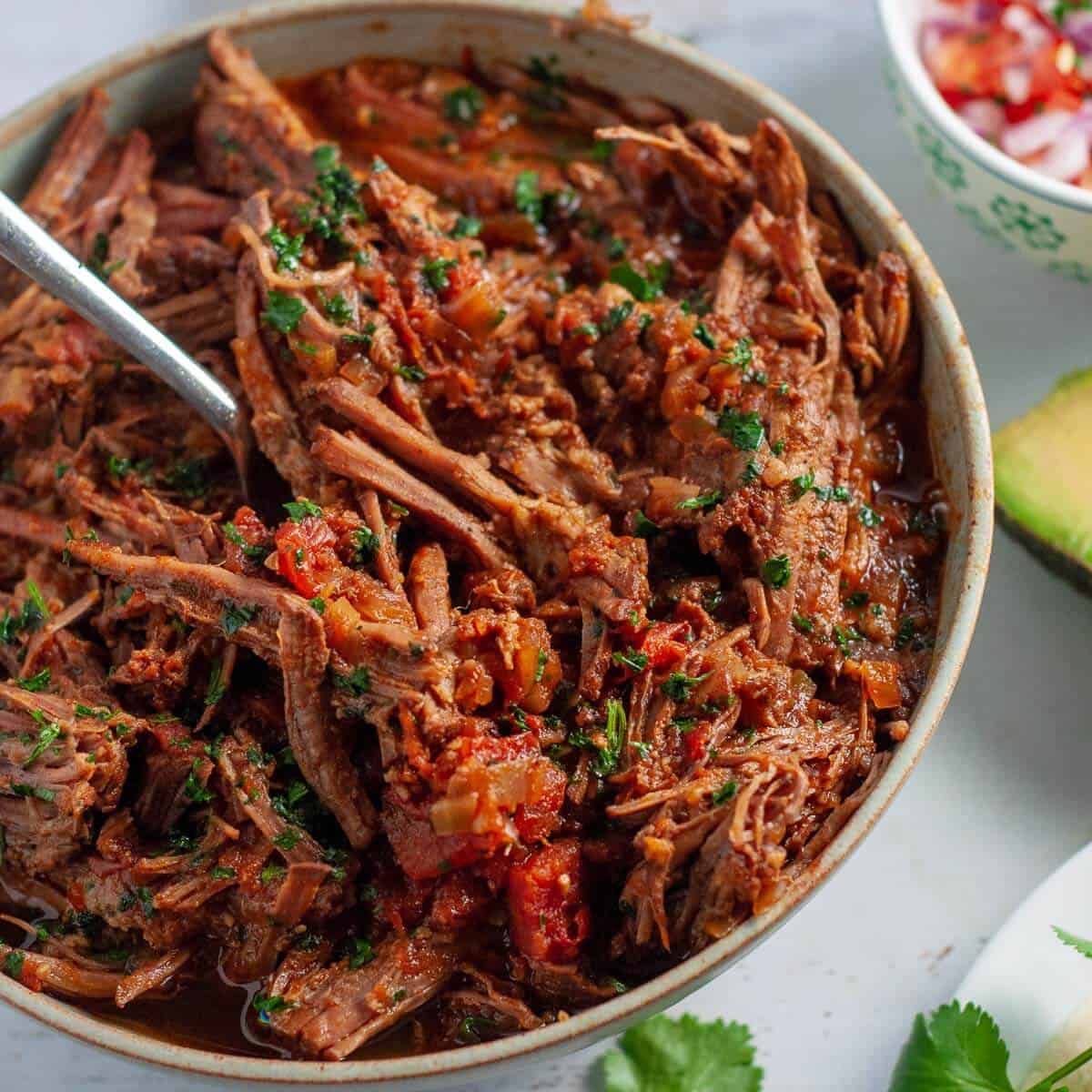 a bowl of shredded beef