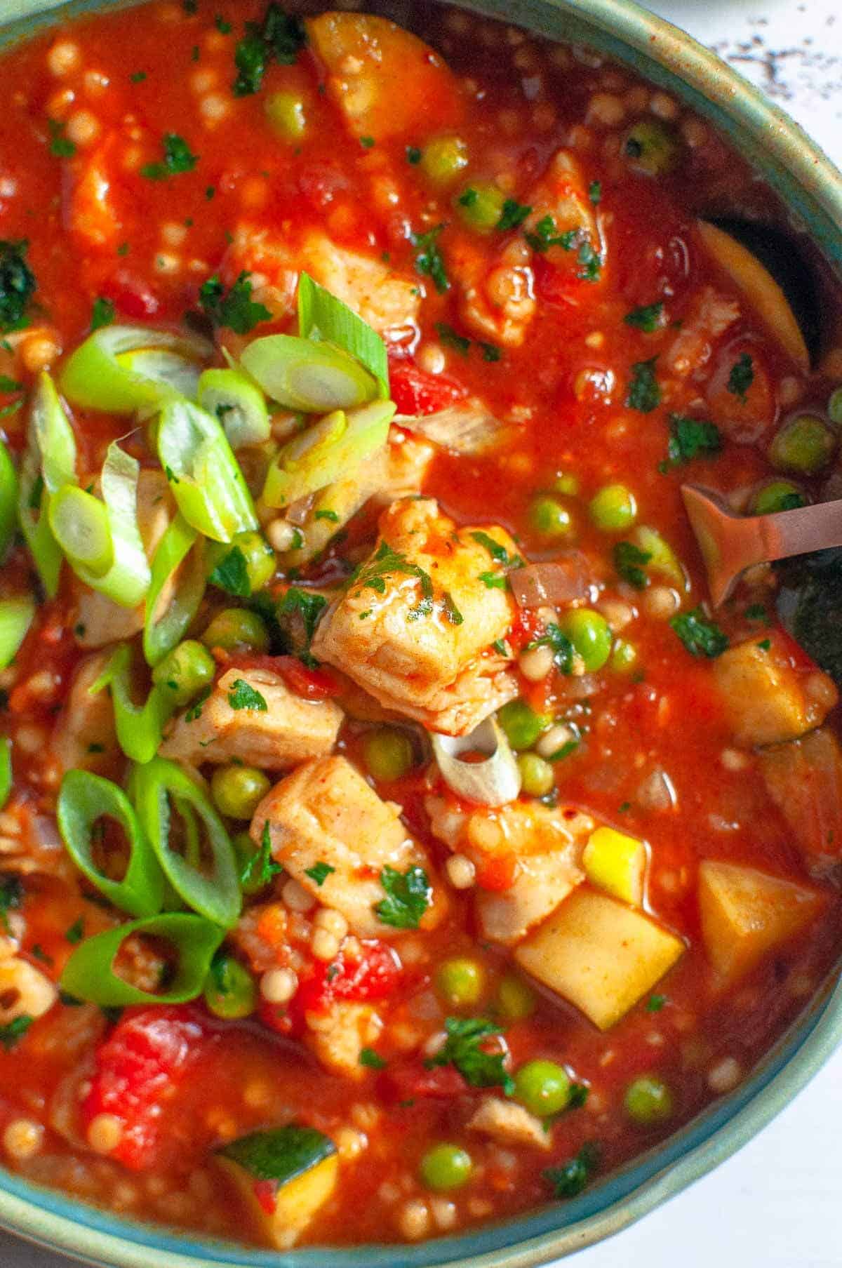 spanish fish stew in a bowl up close