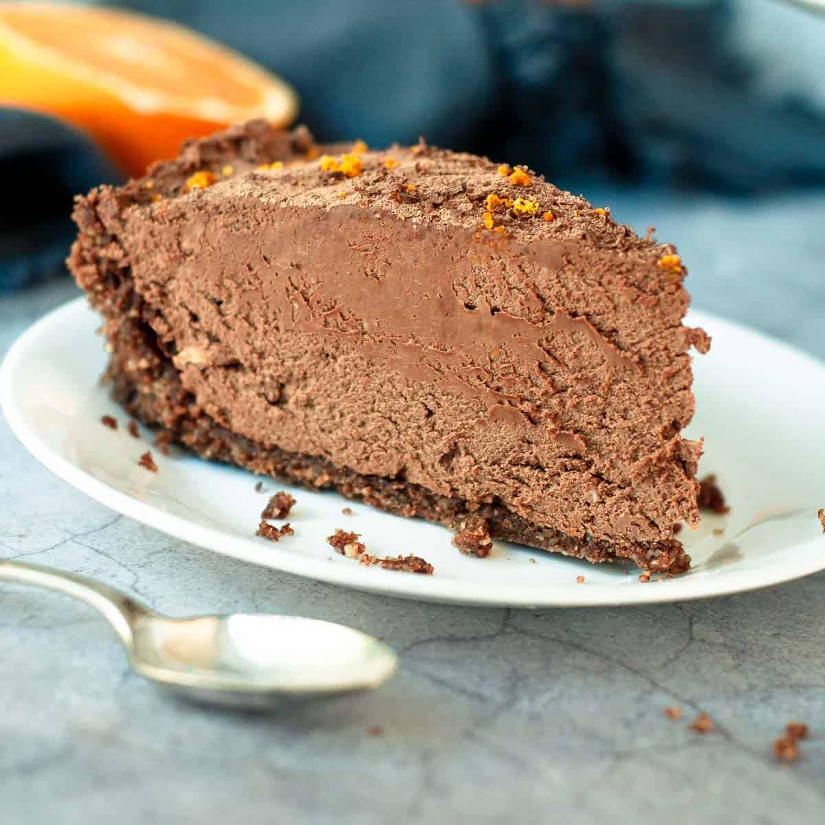 a single slice of chocolate orange cheesecake on a plate